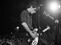 Fugazi  Guy playing the guitar.